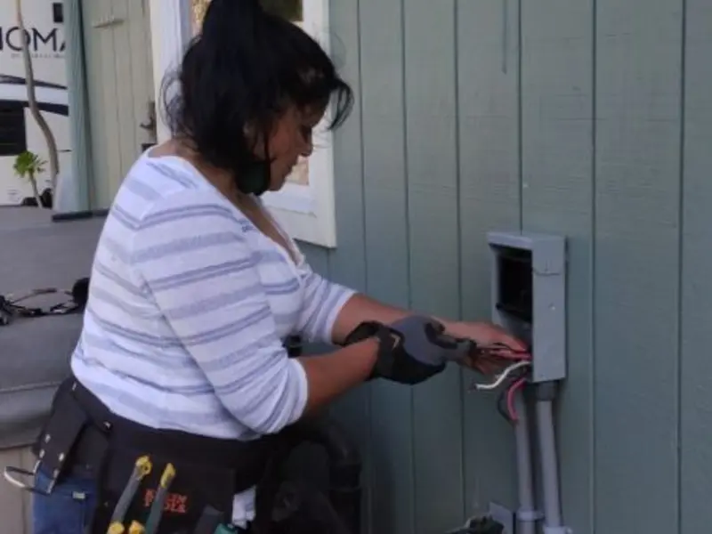 Licensed electrician wiring an exterior subpanel in Town of Pecos