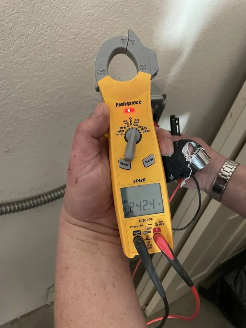 Voltage testing with clamp meter during Circuit Breaker Repair in Town of Pecos